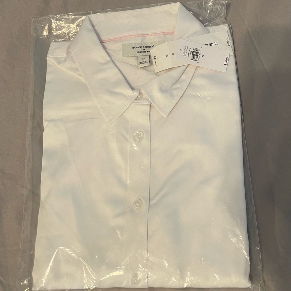 NWT Women’s tailored fit classic white dress shirt. Still in package
